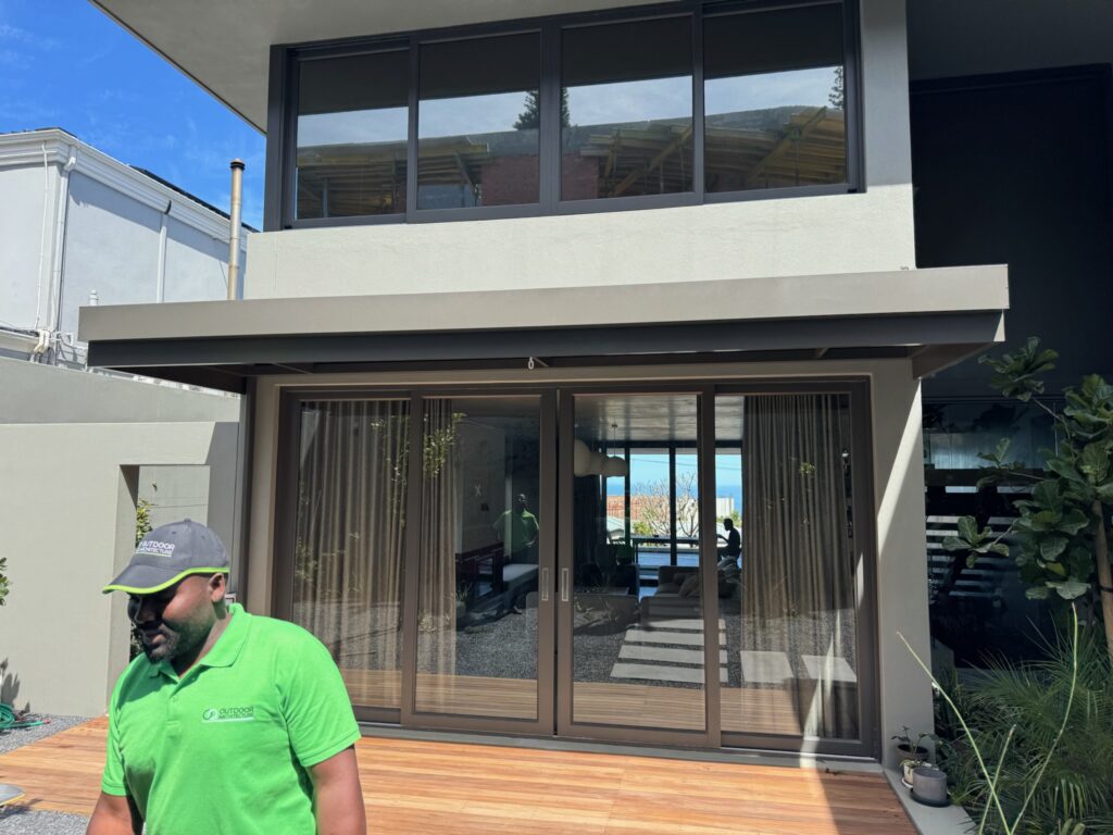 Modern grey aluminium louvre roof for luxury Atlantic Seaboard patio.