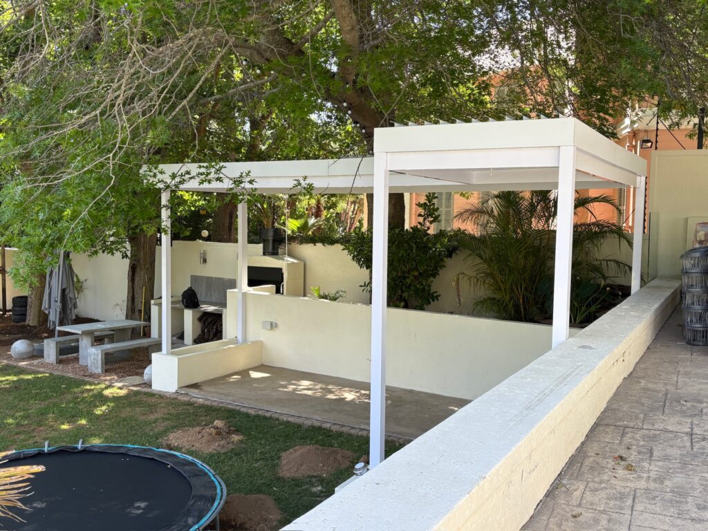 Residential louvre awning installation enhancing property value in Bishopscourt.
